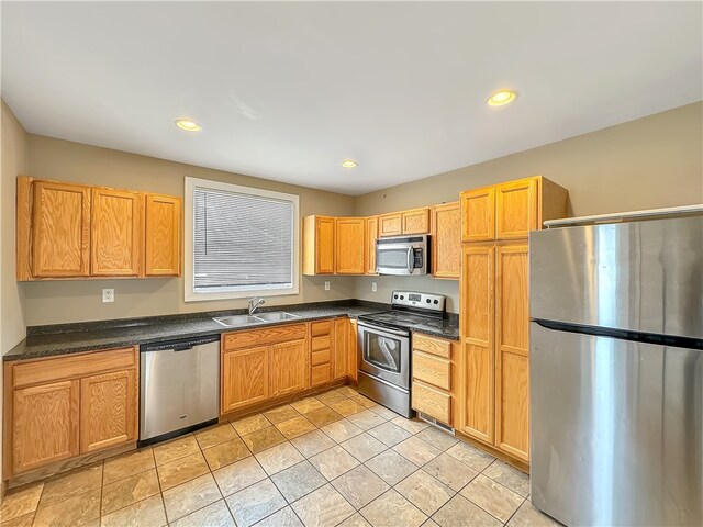 kitchen with sink and appliances with stainless steel finishes