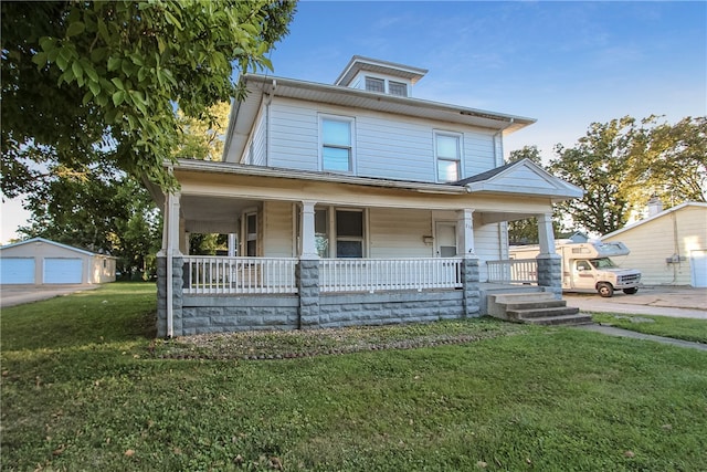 view of front of property featuring an outbuilding, covered porch, and a front yard