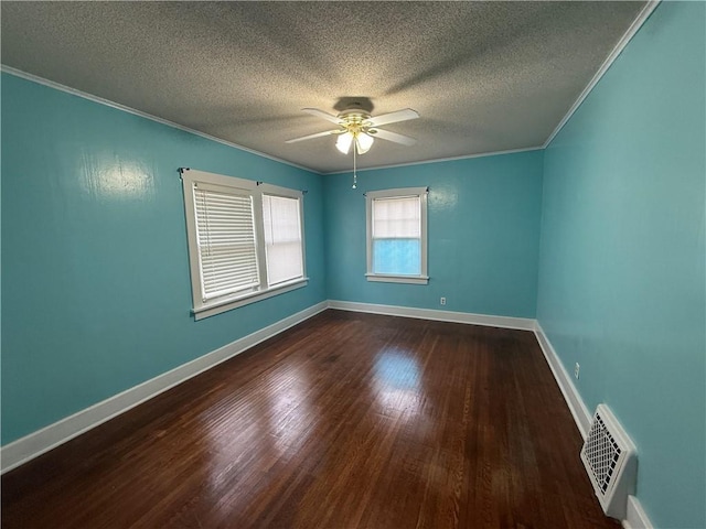 706 Douglas St, Paris, IL 61944 - unfurnished room featuring ornamental molding, a textured ceiling, ceiling fan, dark wood-style flooring, and baseboards