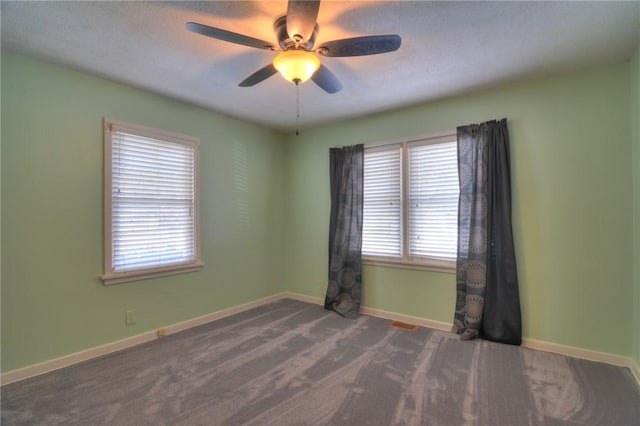 carpeted empty room with ceiling fan