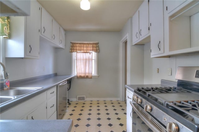 kitchen featuring sink, white cabinets, and appliances with stainless steel finishes