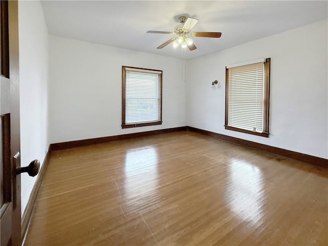 111 Andrew St, Paris, IL 61944 - spare room featuring wood finished floors and ceiling fan
