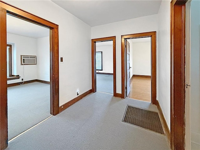 111 Andrew St, Paris, IL 61944 - hallway featuring an AC wall unit and carpet