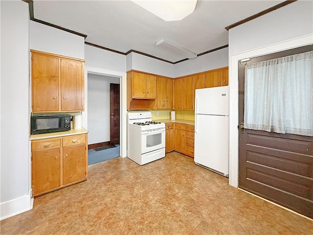 111 Andrew St, Paris, IL 61944 - kitchen with white appliances, light floors, light countertops, brown cabinetry, and crown molding
