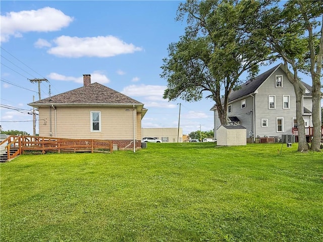 111 Andrew St, Paris, IL 61944 - view of grassy yard with a shed and a wooden deck