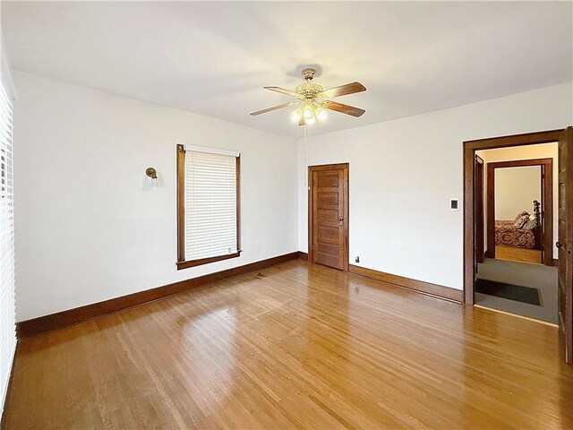 111 Andrew St, Paris, IL 61944 - empty room with light wood finished floors and ceiling fan