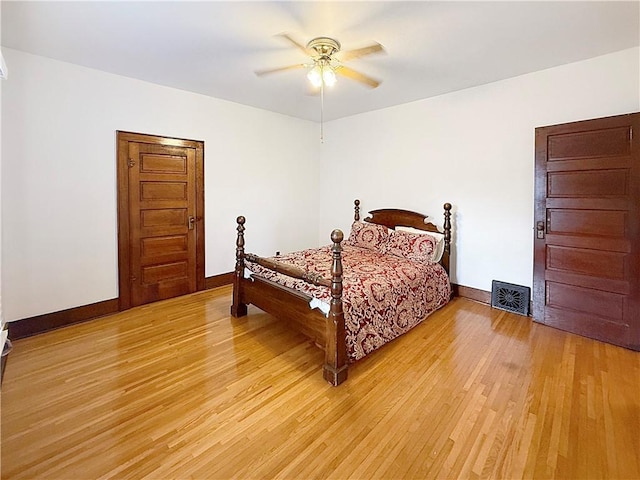 111 Andrew St, Paris, IL 61944 - bedroom with light wood-style flooring and ceiling fan