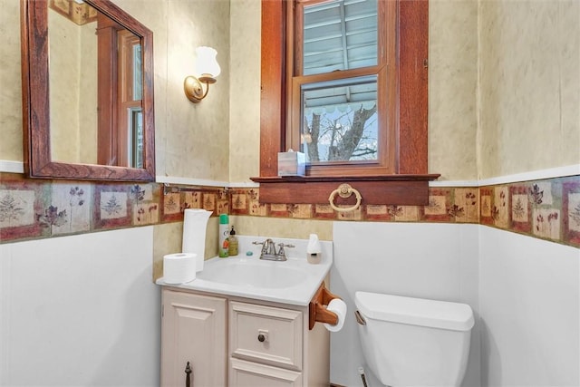 bathroom featuring toilet and vanity