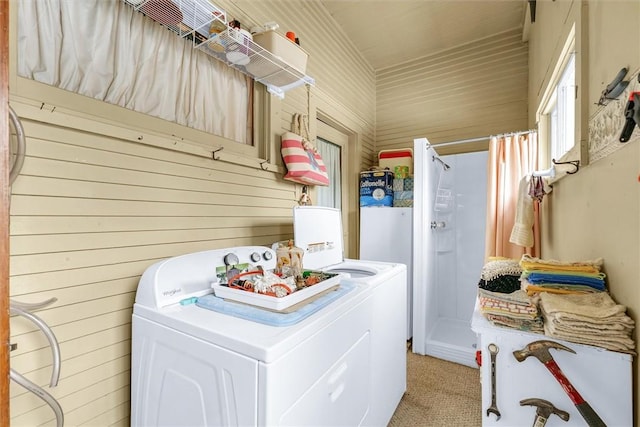 laundry area with light carpet, laundry area, and washing machine and clothes dryer