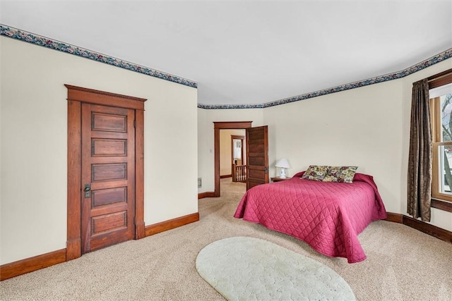 carpeted bedroom with baseboards