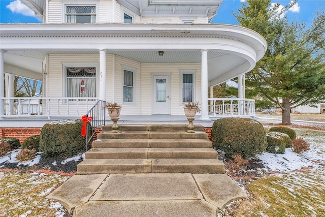 entrance to property with covered porch