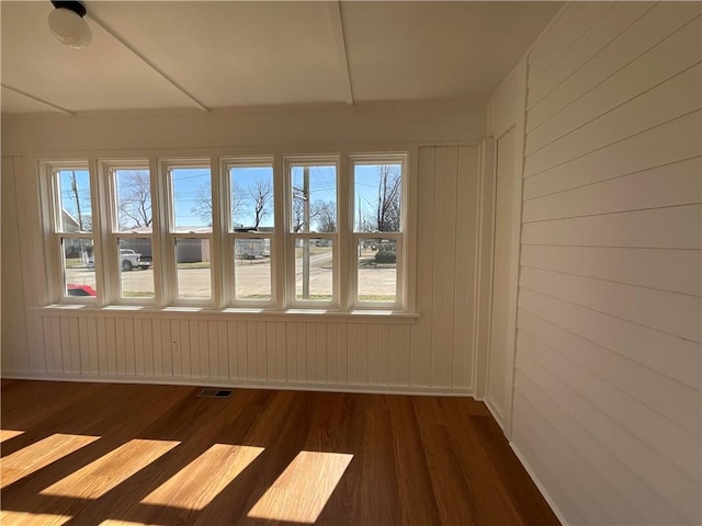 108 W Virginia Ave, Effingham, IL 62401 - empty room featuring dark wood-style flooring, visible vents, and baseboards