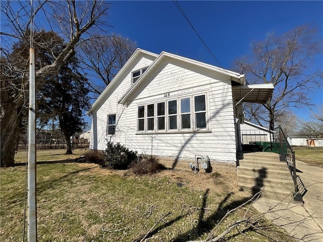 108 W Virginia Ave, Effingham, IL 62401 - view of property exterior featuring a yard