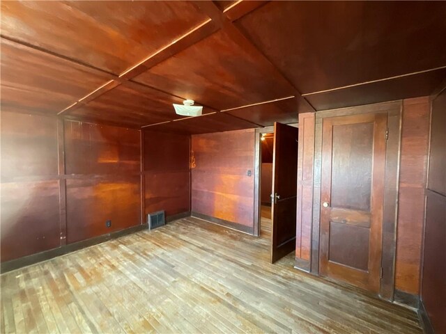 108 W Virginia Ave, Effingham, IL 62401 - interior space featuring wood walls, wood ceiling, visible vents, and wood finished floors