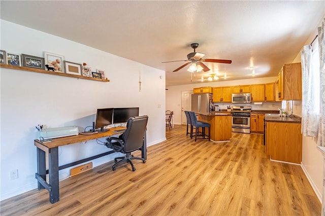 2430 Baker Ln, Decatur, IL 62526 - home office with light wood-style floors and ceiling fan