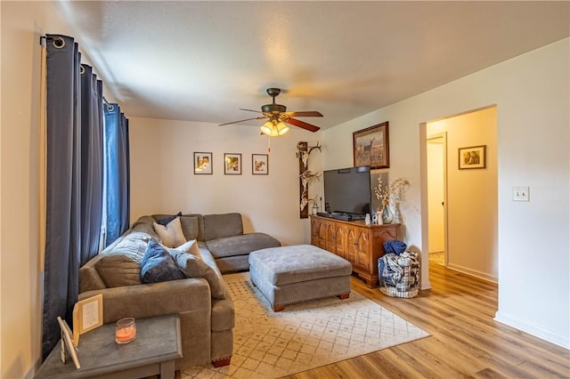 2430 Baker Ln, Decatur, IL 62526 - living area with light wood-style floors and ceiling fan