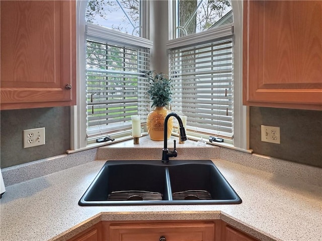 kitchen with a sink and light countertops