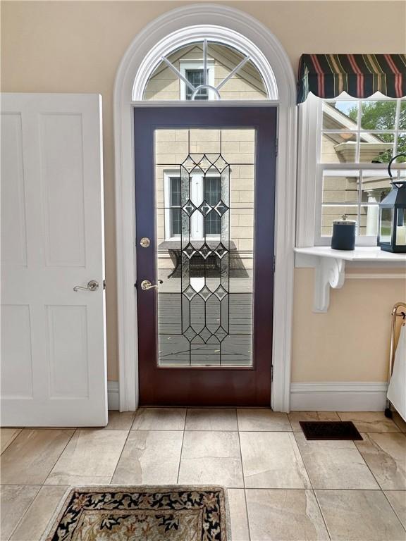 foyer entrance with baseboards