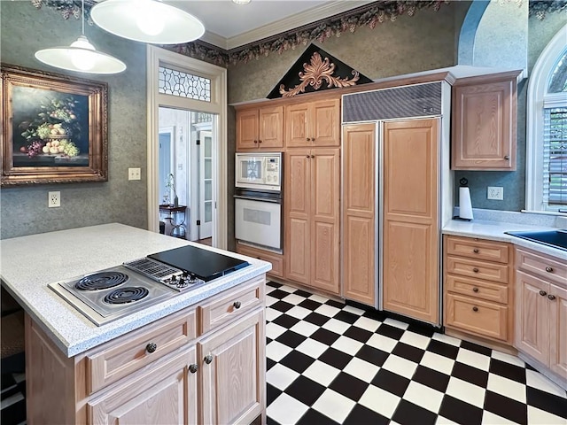 kitchen with built in appliances, tile patterned floors, light countertops, and light brown cabinets