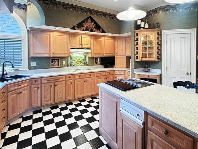 kitchen with light floors, stovetop with downdraft, a sink, under cabinet range hood, and light countertops
