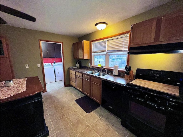 kitchen featuring sink, ventilation hood, independent washer and dryer, a textured ceiling, and black appliances