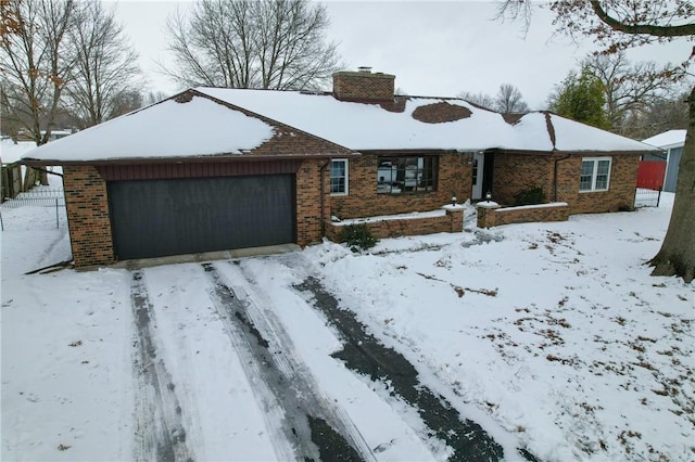 ranch-style home featuring a garage