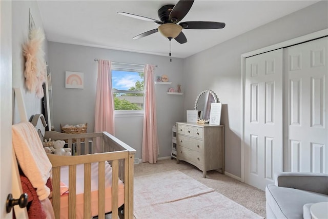 111 W 7th St, Pana, IL 62557 - bedroom featuring light carpet, a crib, baseboards, and ceiling fan