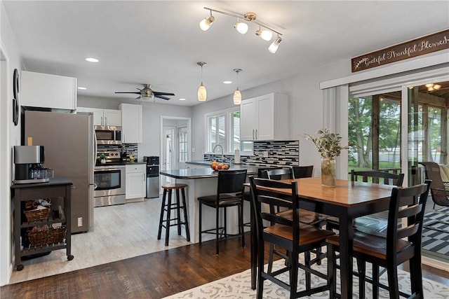 111 W 7th St, Pana, IL 62557 - dining space featuring light wood-type flooring, a ceiling fan, and recessed lighting