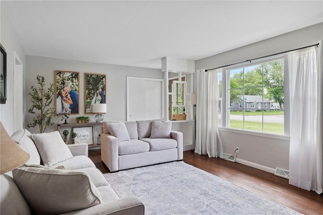 111 W 7th St, Pana, IL 62557 - living area with wood finished floors and baseboards