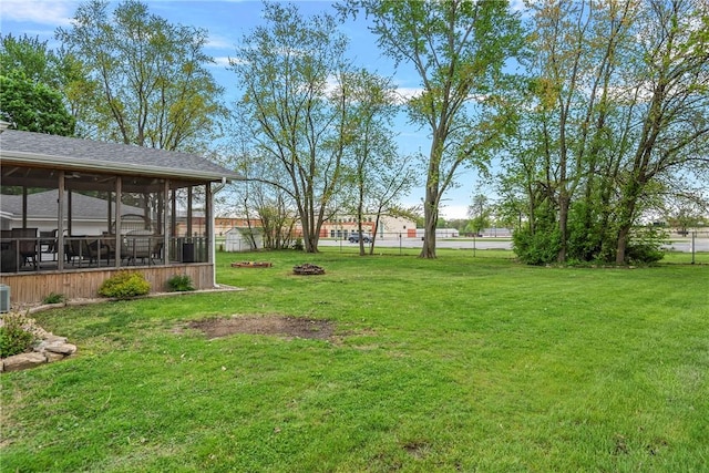 111 W 7th St, Pana, IL 62557 - view of yard featuring a sunroom