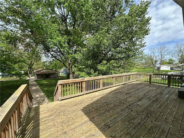 wooden deck with a yard