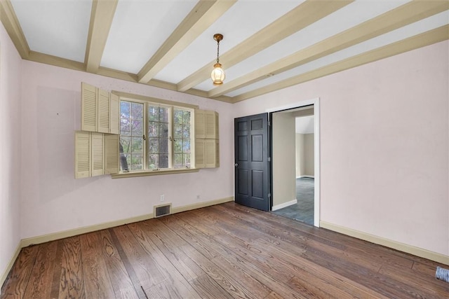 1655 N Vermilion St, Danville, IL 61832 - unfurnished room featuring beamed ceiling, baseboards, visible vents, and wood finished floors