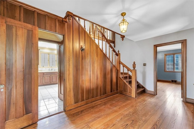 1655 N Vermilion St, Danville, IL 61832 - stairway with baseboards, visible vents, and wood finished floors
