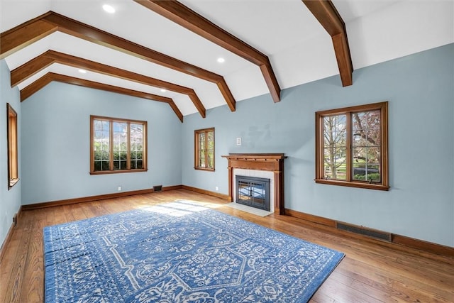 1655 N Vermilion St, Danville, IL 61832 - unfurnished living room with hardwood / wood-style flooring, lofted ceiling with beams, baseboards, and visible vents