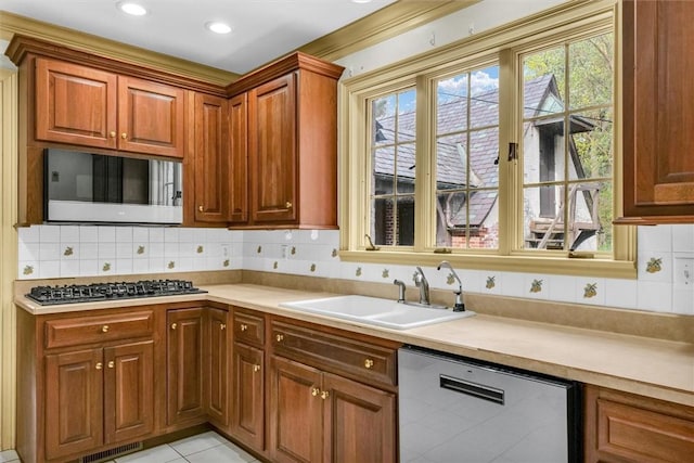 1655 N Vermilion St, Danville, IL 61832 - kitchen with light countertops, stainless steel appliances, tasteful backsplash, and a sink
