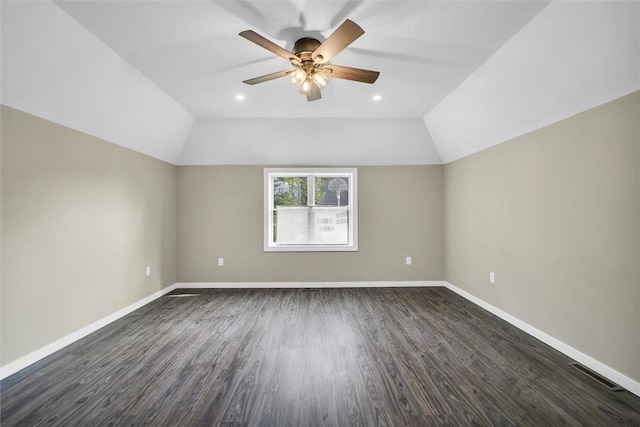 1655 N Vermilion St, Danville, IL 61832 - unfurnished room with lofted ceiling, dark wood-type flooring, visible vents, a ceiling fan, and baseboards