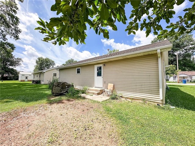 1402 N Howard St, Robinson, IL 62454 - back of house with a lawn