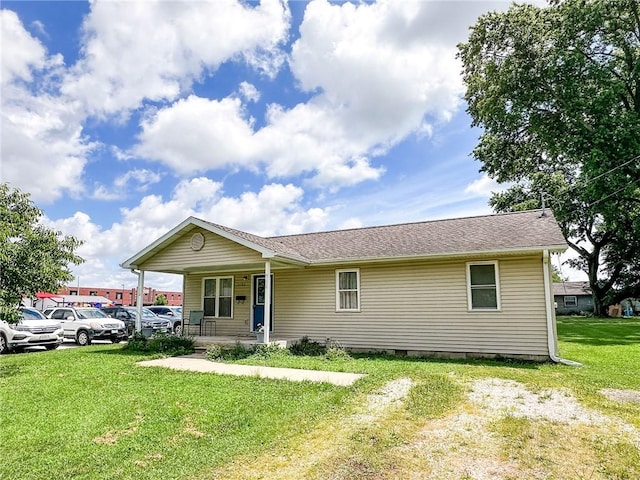 1402 N Howard St, Robinson, IL 62454 - ranch-style house with a porch, a front lawn, and crawl space