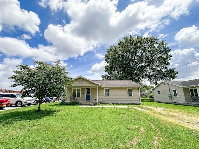 1402 N Howard St, Robinson, IL 62454 - view of front of property featuring a front lawn, covered porch, and crawl space