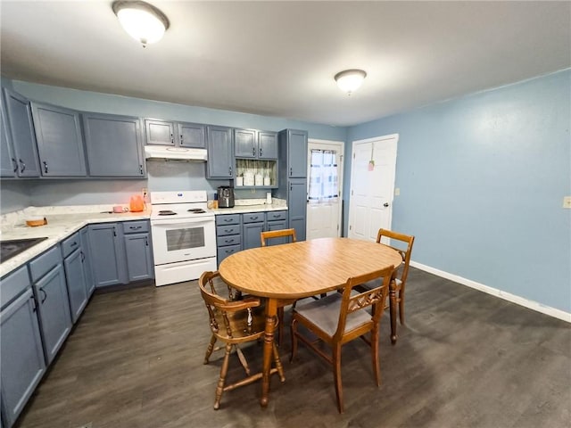1402 N Howard St, Robinson, IL 62454 - kitchen featuring white electric range, under cabinet range hood, gray cabinets, dark wood finished floors, and light countertops