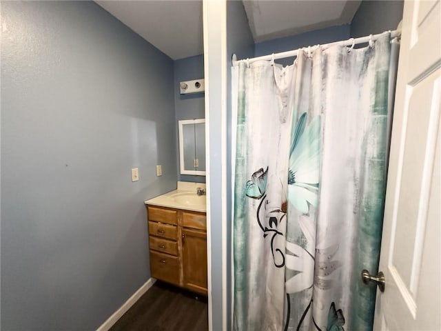 1402 N Howard St, Robinson, IL 62454 - full bathroom with vanity, wood finished floors, and a shower with shower curtain