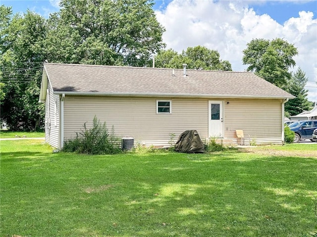 1402 N Howard St, Robinson, IL 62454 - back of property with a lawn and roof with shingles