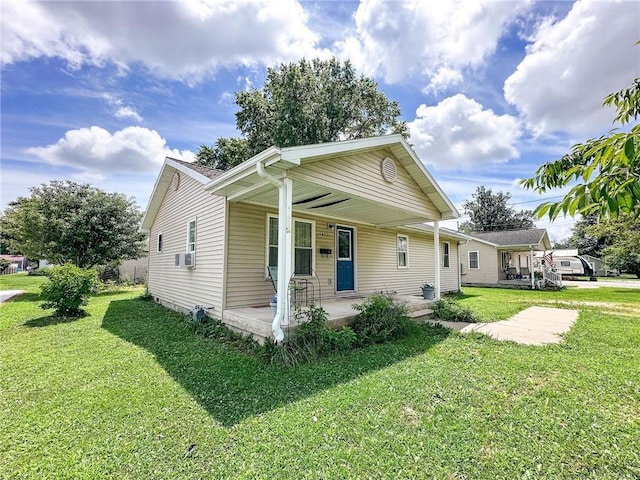 1402 N Howard St, Robinson, IL 62454 - view of front of property with a porch and a front yard