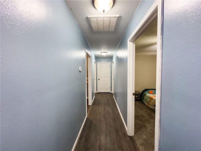1402 N Howard St, Robinson, IL 62454 - corridor featuring dark wood-type flooring and baseboards