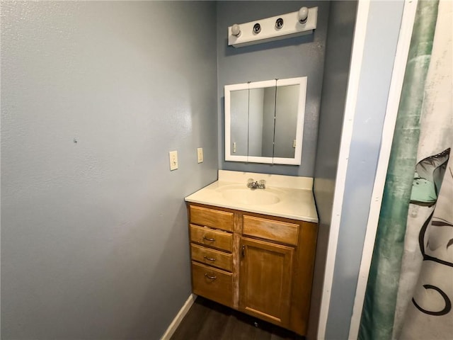 1402 N Howard St, Robinson, IL 62454 - bathroom with vanity and wood finished floors
