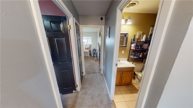 1516 Eastview Ave, Danville, IL 61832 - hall featuring light colored carpet and light tile patterned floors