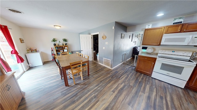 1516 Eastview Ave, Danville, IL 61832 - kitchen featuring white appliances, dark wood-style flooring, brown cabinets, light countertops, and a textured ceiling