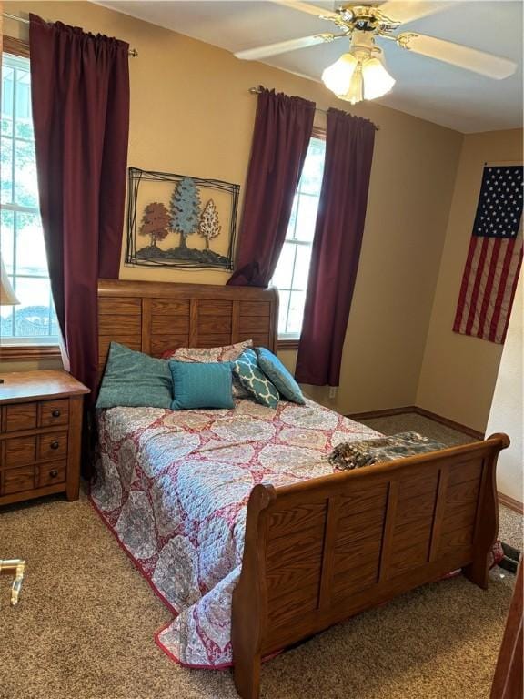 bedroom with ceiling fan and carpet flooring