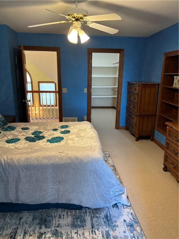 carpeted bedroom featuring a ceiling fan
