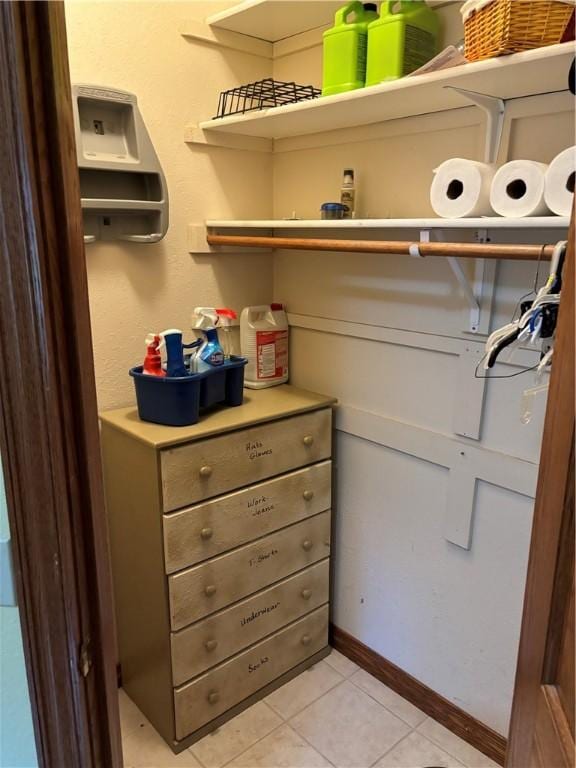 spacious closet featuring light tile patterned flooring